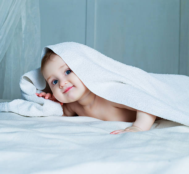 istock baby with a towel 588974520
