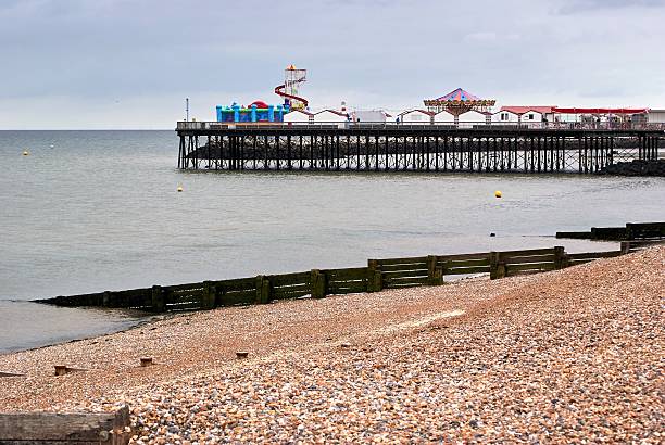 Herne Bay Pier Kent England View of Herne bay pier as the tide is coming in. herne bay stock pictures, royalty-free photos & images