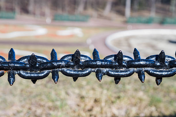 istock Decorative fence hanging chain obstruction 588974914