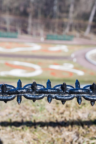 istock Decorative fence hanging chain obstruction 588974928