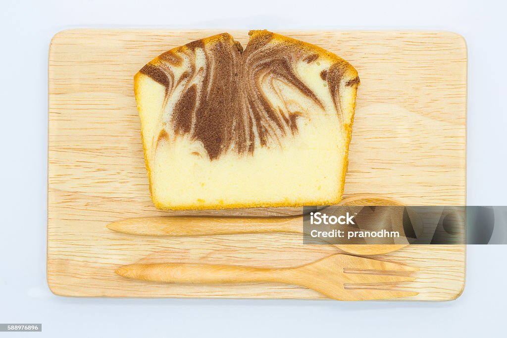 Homemade marble butter cake on wooden board Homemade marble butter cake on wooden board, isolated Bakery Stock Photo