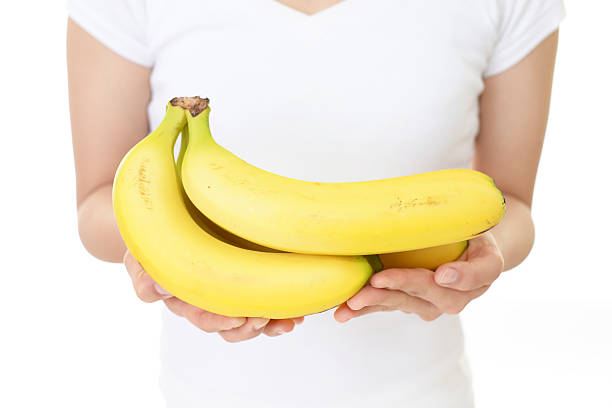 istock Woman holding fruits 588977838