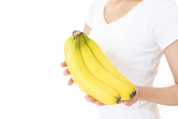 istock Woman holding fruits 588977974
