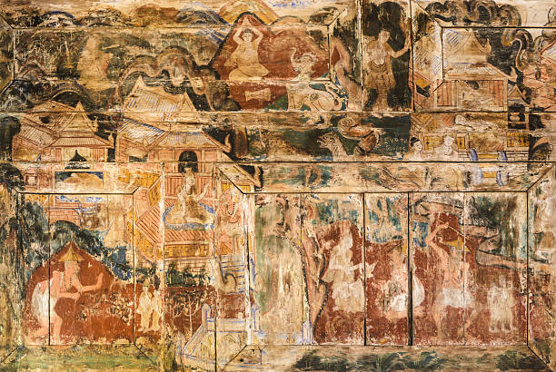 istock Ancient Thai mural painting on wooden temple wall 588979976