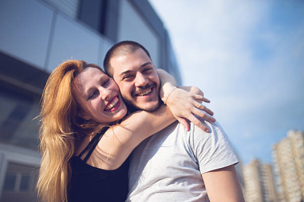 istock Couple hugging outdoors 588982448