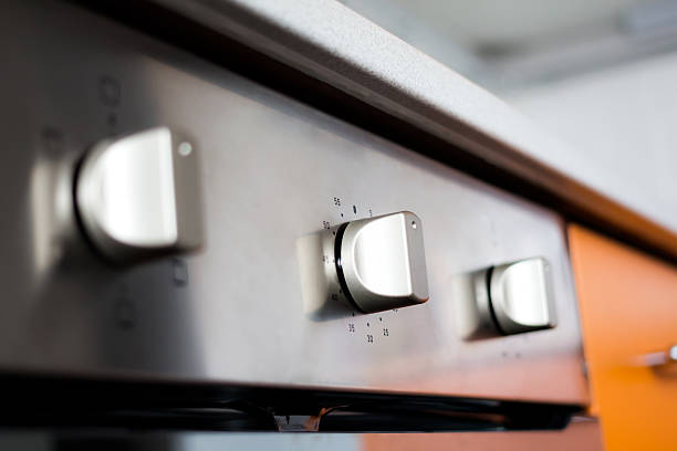 Kitchen oven stainless steel panel with buttons and knobs