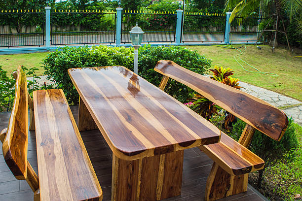 istock wooden dining table set in lush garden setting 588984598