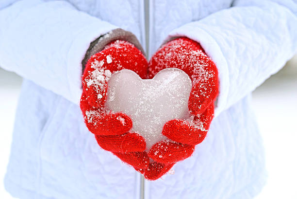 istock ice heart in red gloves 588988194