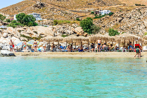 Kolimbithres - Famous beach of Paros, Greece Paros, Greece - June 17, 2016: Kolimbithres, the most famous beach on the island known for its unique rock formations. Photo taken during a hot summer day and contains some tourists enjoying the beach. paros stock pictures, royalty-free photos & images