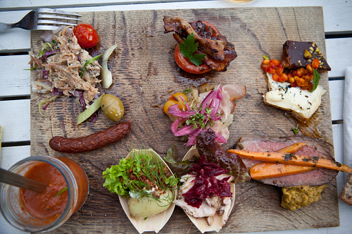 Lovely little appetizers - served on wooden board. Bornholm.