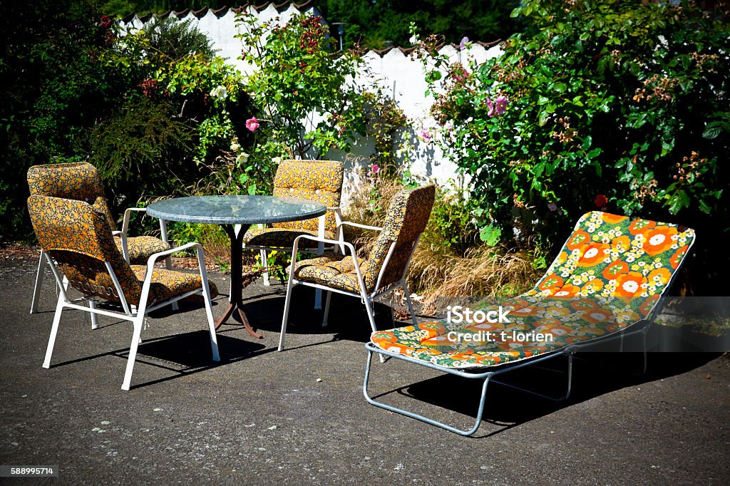 Retro Summer Retro garden furniture from the 70 ties in garden. Denmark Armchair Stock Photo