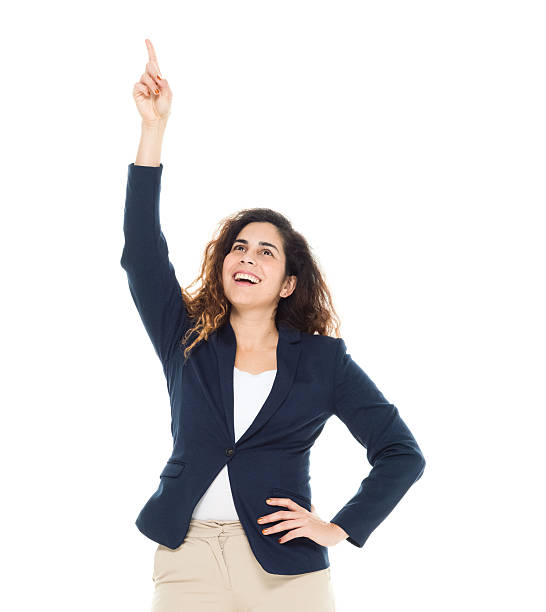 istock Cheerful businesswoman pointing up 588996458