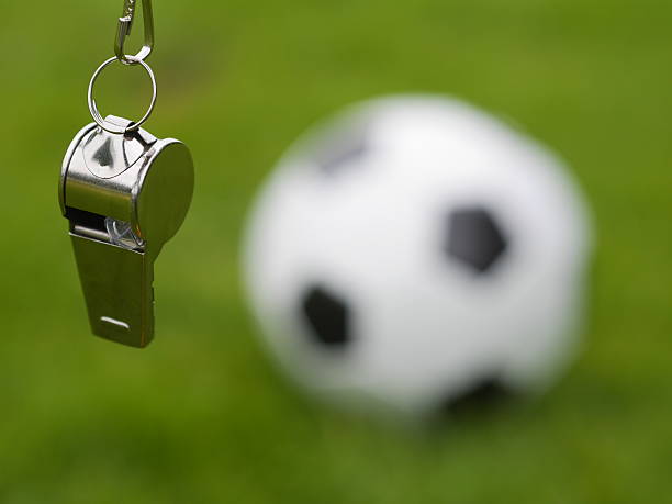 referee whistle referee whistle in front of soccer ball referee stock pictures, royalty-free photos & images