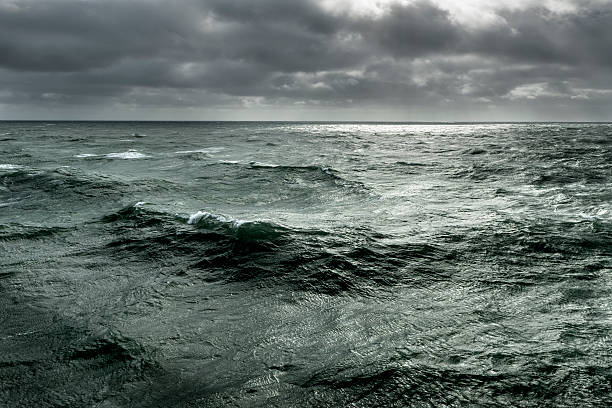 istock Winter storm over ocean with rough seas 588998186