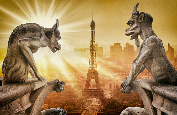 istock Gargoyle figur on Notre Dame looking towards Eiffel Tower 588999778