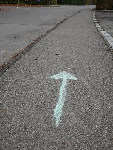 istock chalk arrow on road 589001150