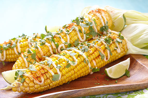 istock grilled corn with chili peppers, white sauce and herbs 589086870