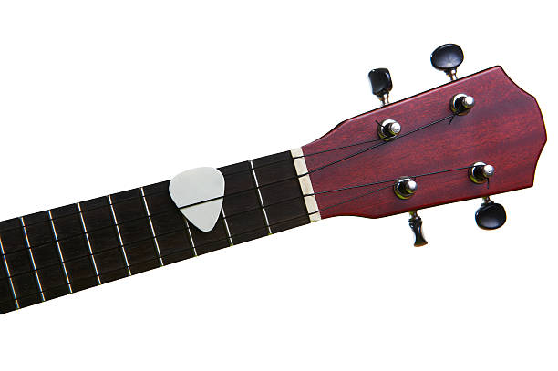 istock White pick with ukulele fingerboard, isolated on 589090858
