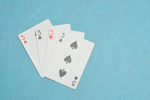 istock The different suits of a the number 3 card 589091420
