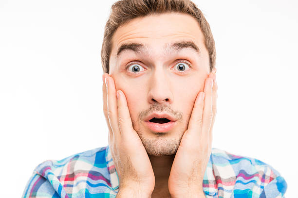 istock Closeup photo of a surprised handsome man 589093446