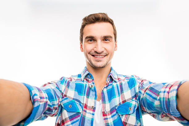 istock Handsome young man making selfie photo 589094528