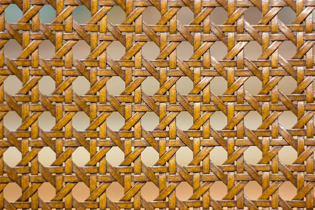 istock Woven wooden chair with blurry background 589094758