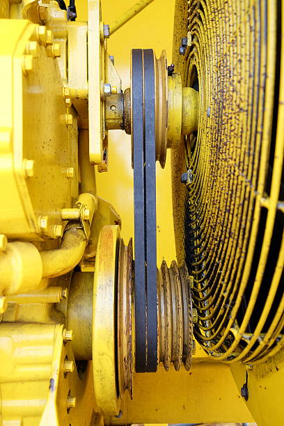 istock Yellow engine transmission from wedge belts and pulleys 589094894