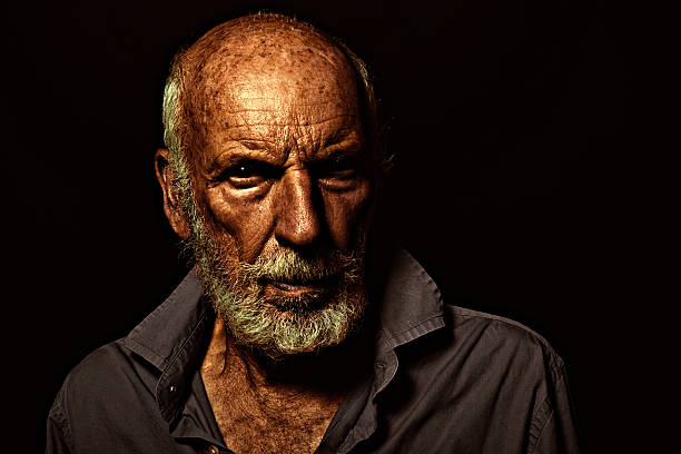istock Old Guy, Desaturated Low-Key Grunge Lighting, Senior Man, Gothic Style 589096812