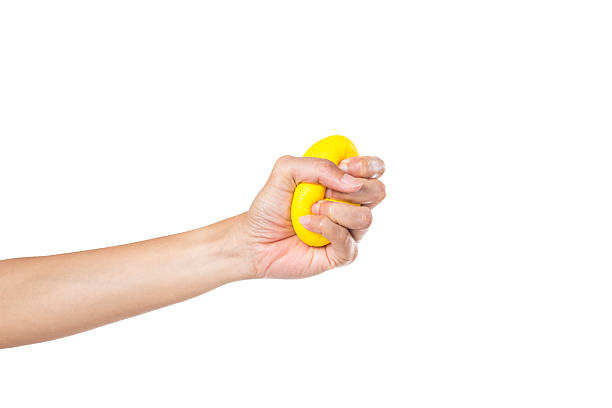 istock Hands of a woman squeezing a stress ball 589097068