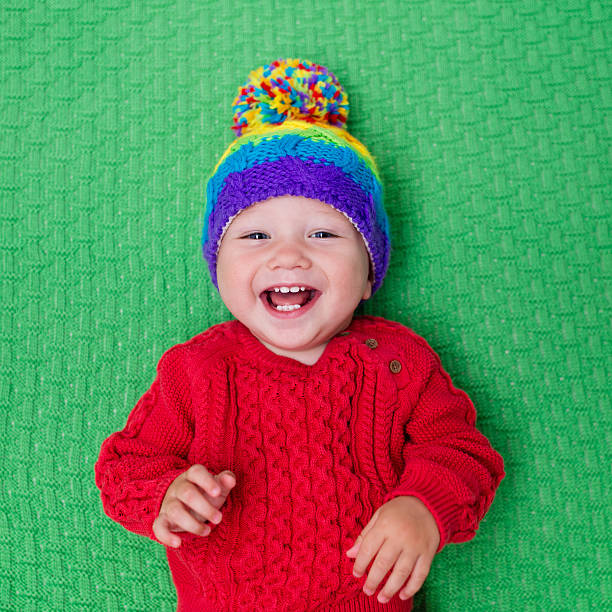 istock Little baby in warm knitted hat 589097110