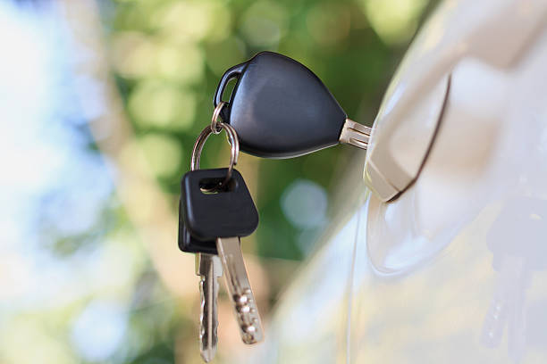 istock Car keys left in the car door 589097774