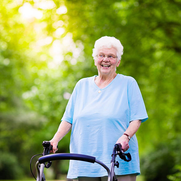istock Happy senior lady with a walker 589098370
