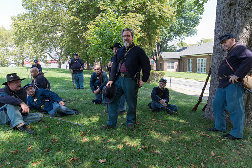 New York, NY USA - August 13, 2016: Members of 119th New York Volunteer Infantry  living history organization put on Civil War musket demonstrations at National Park Service annual Civil War heritage weekend at Governors Island