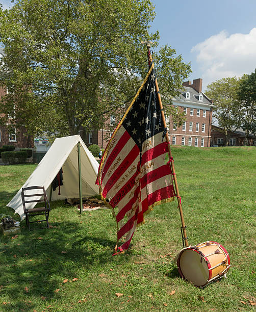 Civil War enactment New York, NY USA _ August 13, 2016: American flag of 119th New York Volunteer Infantry  living history organization at National Park Service annual Civil War heritage weekend at Governors Island civil war enactment stock pictures, royalty-free photos & images