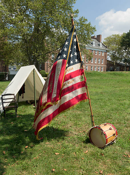 Civil War enactment New York, NY USA _ August 13, 2016: American flag of 119th New York Volunteer Infantry  living history organization at National Park Service annual Civil War heritage weekend at Governors Island civil war enactment stock pictures, royalty-free photos & images