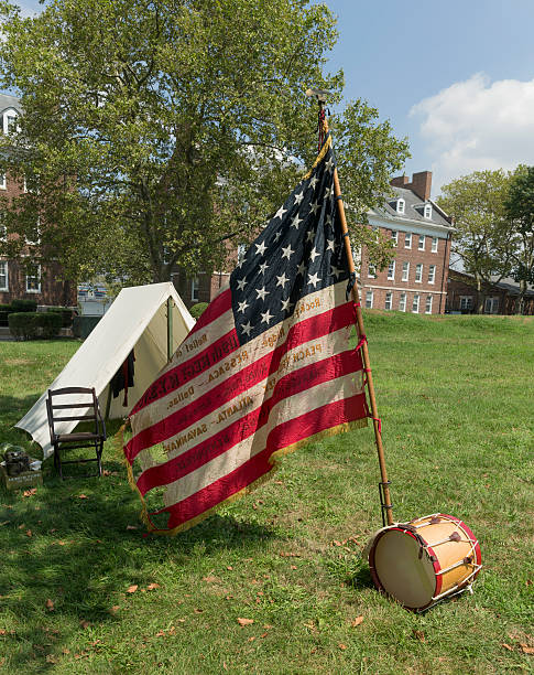 Civil War enactment  New York, NY USA _ August 13, 2016: American flag of 119th New York Volunteer Infantry  living history organization at National Park Service annual Civil War heritage weekend at Governors Island civil war enactment stock pictures, royalty-free photos & images