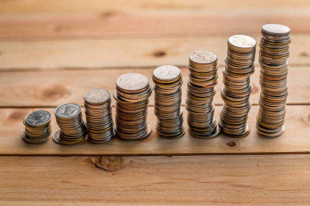 istock coins placed on a wooden floor 589099702