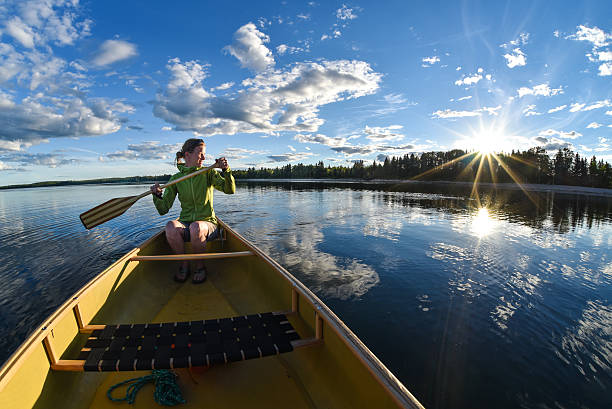 Woman Canoeing stock photo