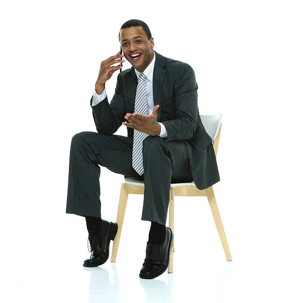 istock Cheerful businessman talking on phone 589101518