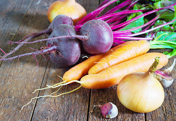 istock Different, fresh, young vegetables, beets, carrots, tomato, onions lie 589104524