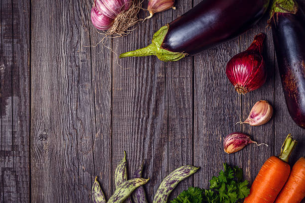istock Fresh vegetables for cooking on dark wooden background. 589105570