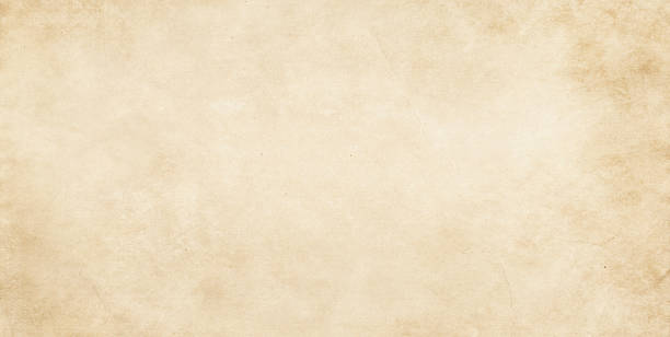 istock Aged yellowes paper background or texture. 589106394
