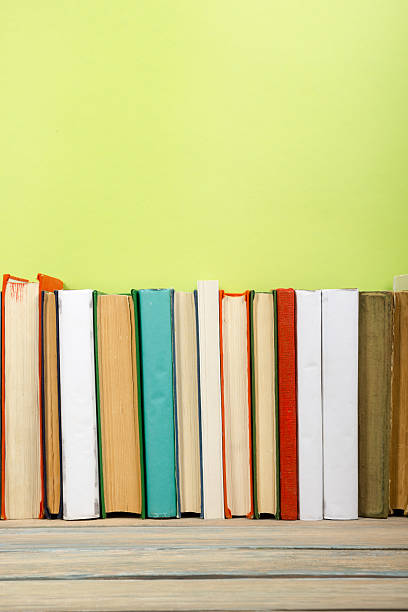 istock Colorful composition with vintage old hardback books stacking, diary on 589107432