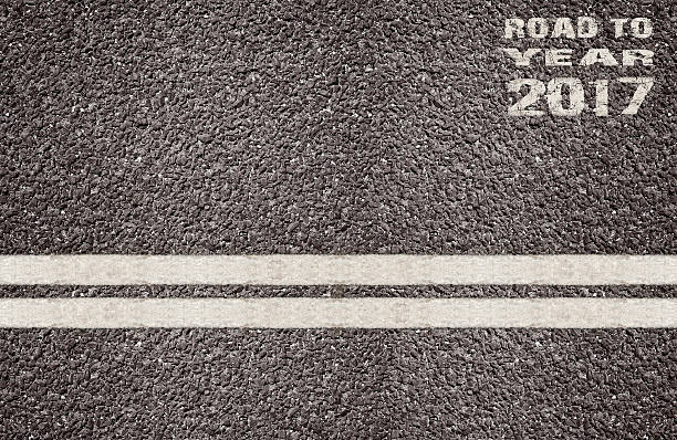 istock Double white line on surface of asphalt road. 589110964