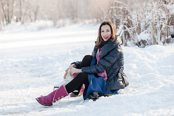 istock Cheerful girl having fun in winter ice skating. 589111352
