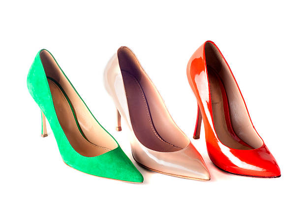 bright, multicolored female shoes on high heels bright, multicolored female shoes on high heels isolated on white background womens blue suede shoes stock pictures, royalty-free photos & images