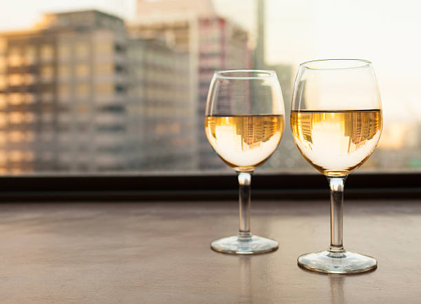 istock Wine glasses with city view 589113444