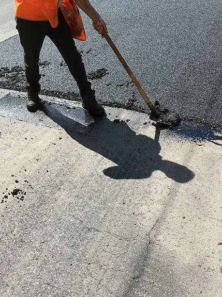 istock worker asphalt road in the summer 589114656
