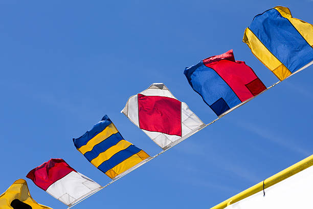 istock Nautical flags against the blue sky 589115192