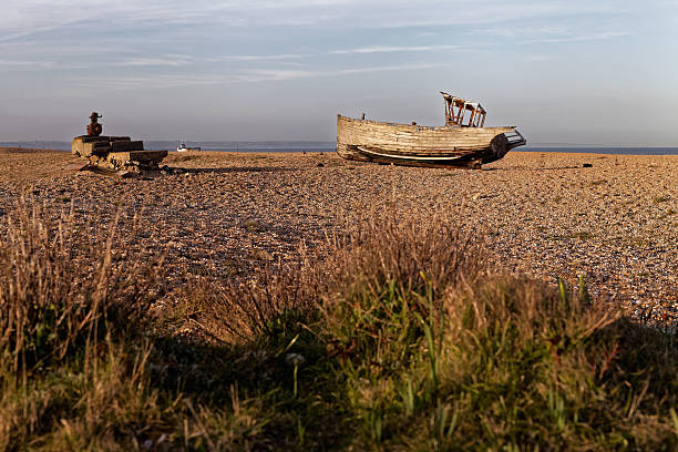 istock Beach with old fishing boat 589117002